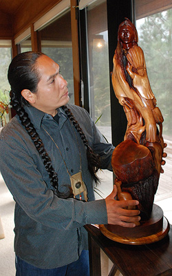 Photo credit - Madera Tribune - Alex with manzanita carving "Buffalo Song"